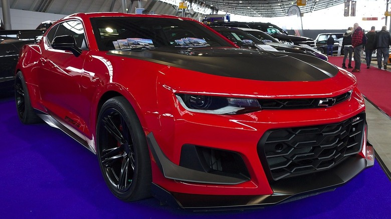 red and black chevrolet camaro ZL1 at car show