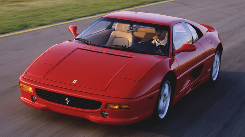 Red Ferrari F355 F1 on road