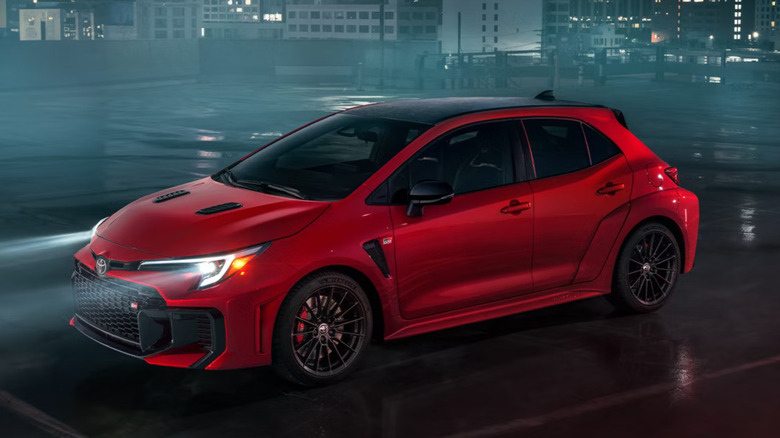red 2025 Toyota GR Corolla in front of buildings promotional image