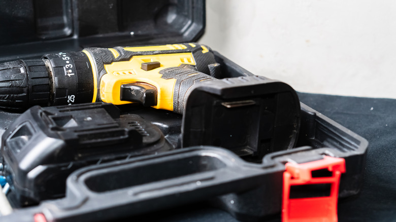 a drill in storage box