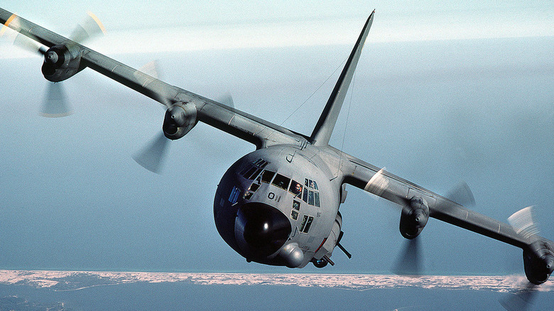 Lockheed AC-130 Gunship banking left in the air