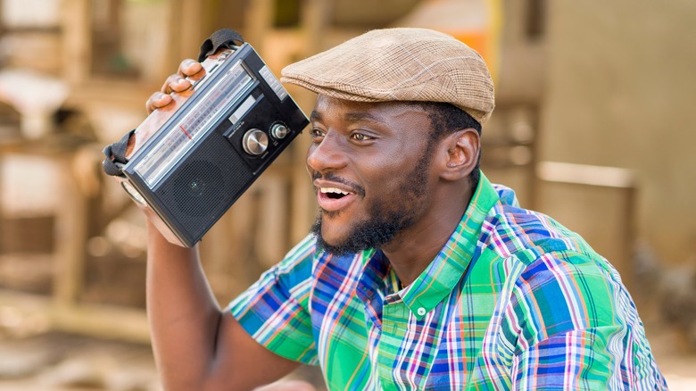 man listening to radio