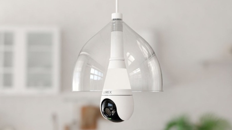 Clear glass light fixture containing a lightbulb camera
