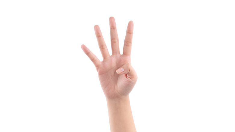 Hand counting number four