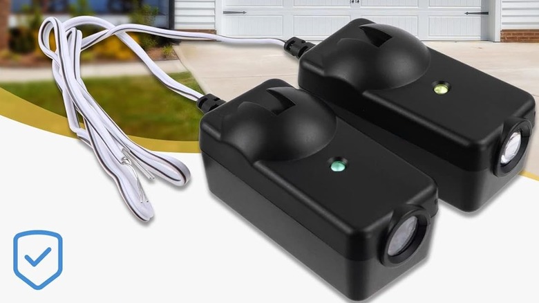 Garage door sensors superimposed on photo of a driveway.