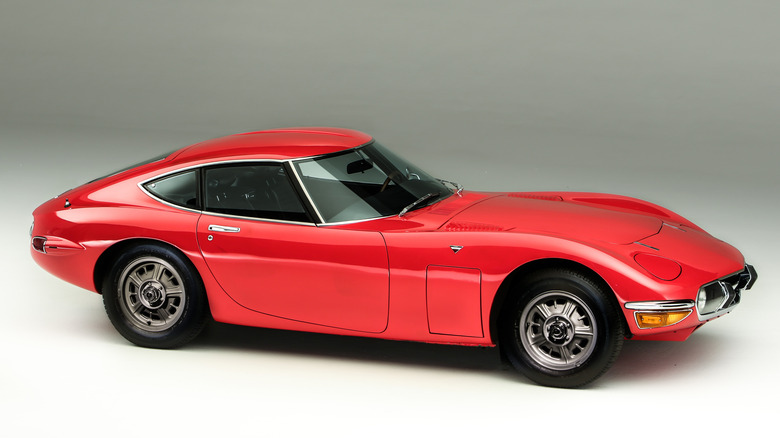 Toyota 2000GT parked in a photo studio