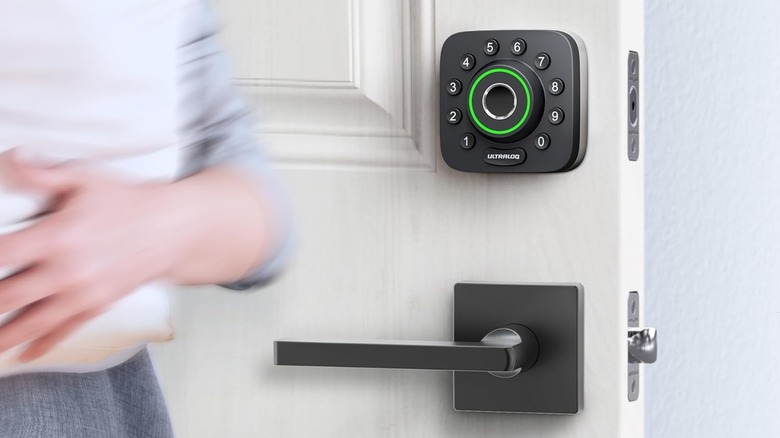 woman standing next to ULTRALOQ smart lock