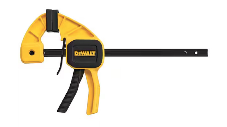 A stock image of a DeWalt Trigger Clamp in yellow.