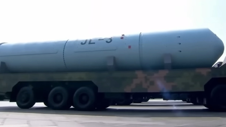 A huge JL-3 nuclear missile being moved on the back of a multi-axle truck.