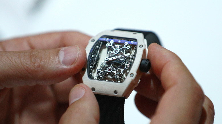 Man holding a unspecified Richard Mille watch