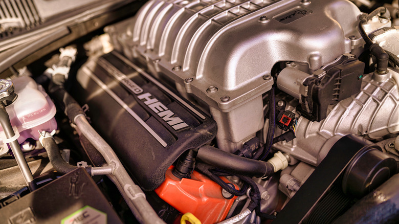 A close-up of a supercharged Hemi V8 engine in a vehicle engine bay.