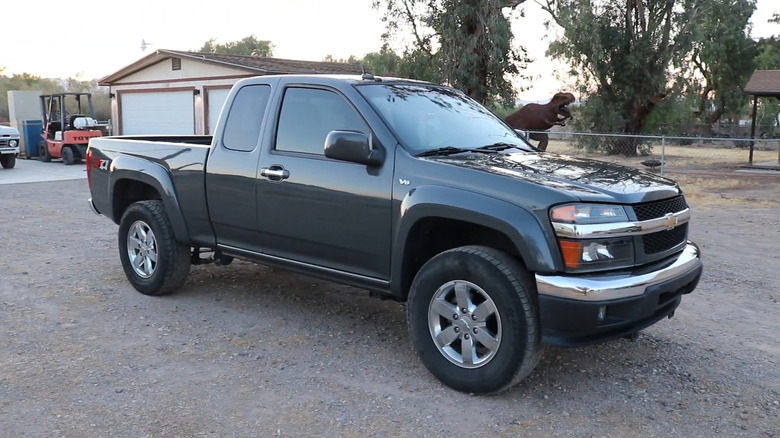 A side on shot of a black 2012 Chevrolet Colorado parked