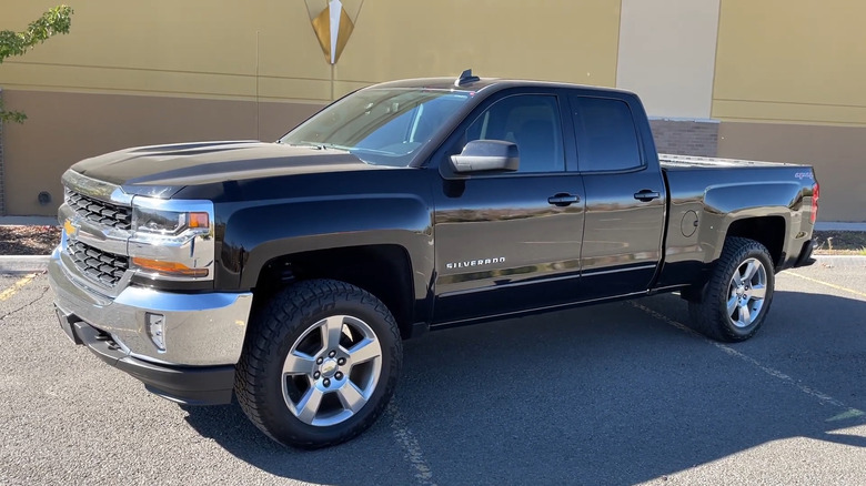 A side on shot of a black 2016 Chevrolet Silverado parked