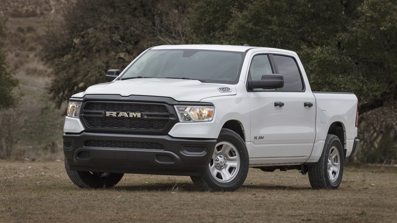 A side shot of a white 2020 Ram 1500 Tradesman parked
