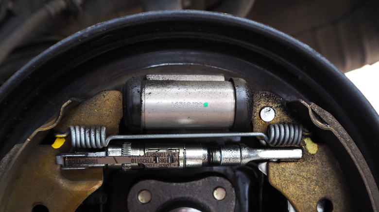 A wheel cylinder in place in a drum brake system
