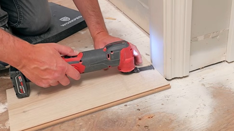 Trimming door jamb with multi-tool