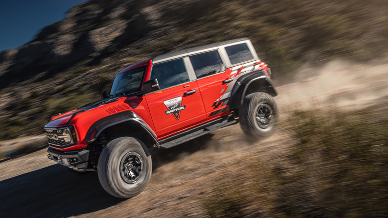 2025 Ford Bronco Raptor off-roading at speed side-to-front view