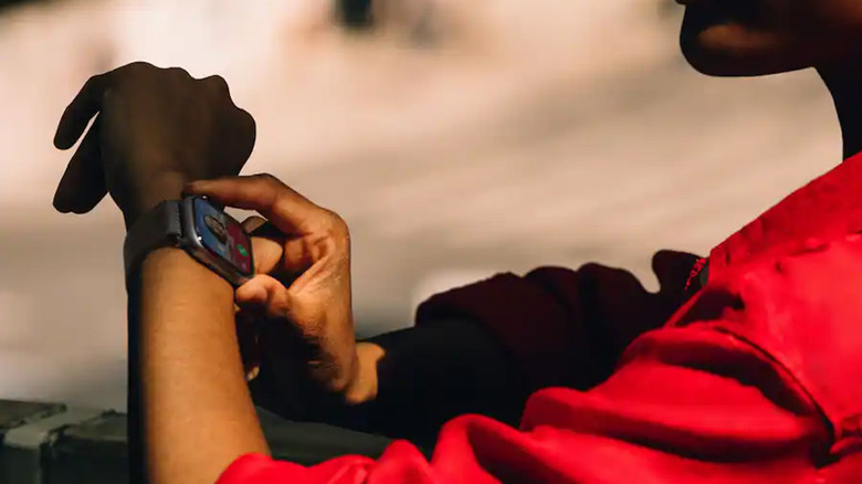 A person answering a call on their Apple Watch