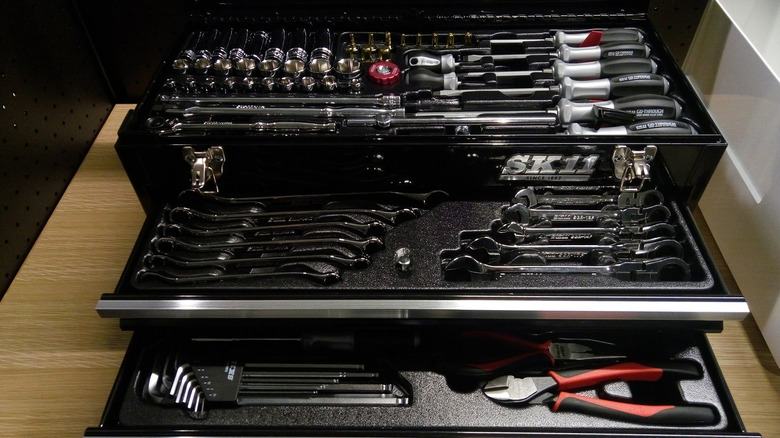 A toolbox with many tools that are organized neatly