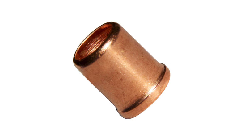 A brass crimp-style wire connector