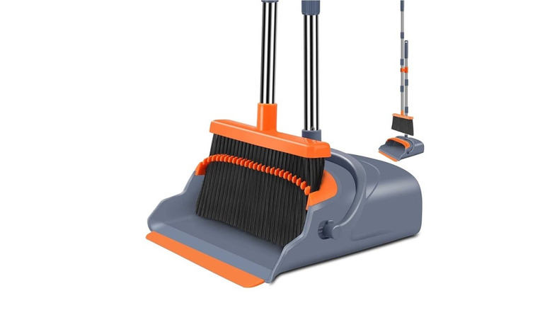 broom and dustpan white background