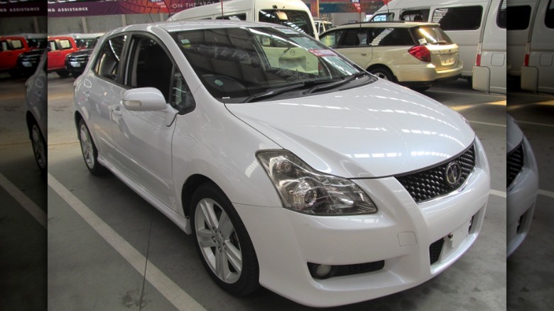 White Toyota Blade Master-G parked in a warehouse