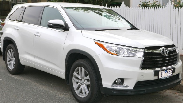 White Toyota Kluger parked in residential area