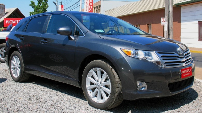 Black Toyota Venza parked at a dealership
