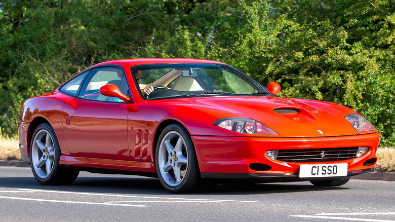 A red Ferrari 550 Maranello parked.