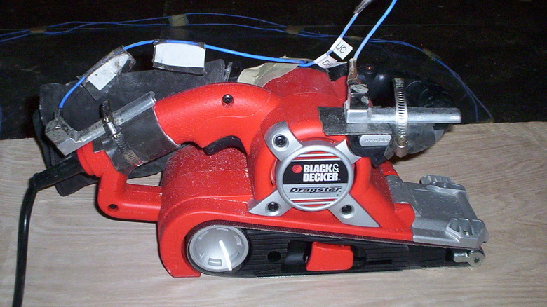 Belt Sander on a wooden surface