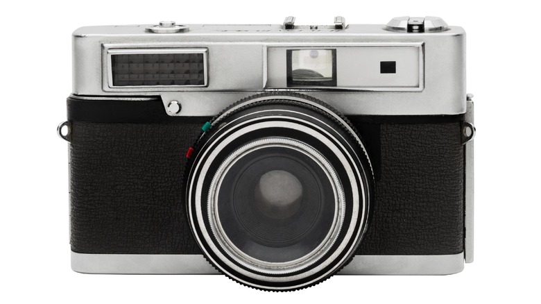 Old-fashioned camera on a white background