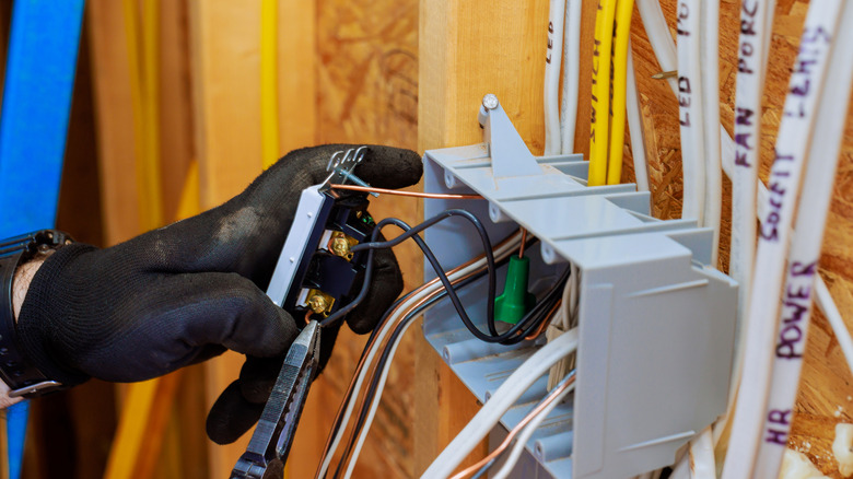 Electrician installing wiring