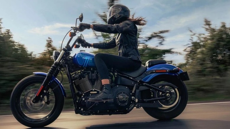 A lady riding a Harley-Davidson Street Bob 114 Motorcycle
