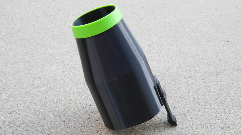 Large black nozzle with a green tip