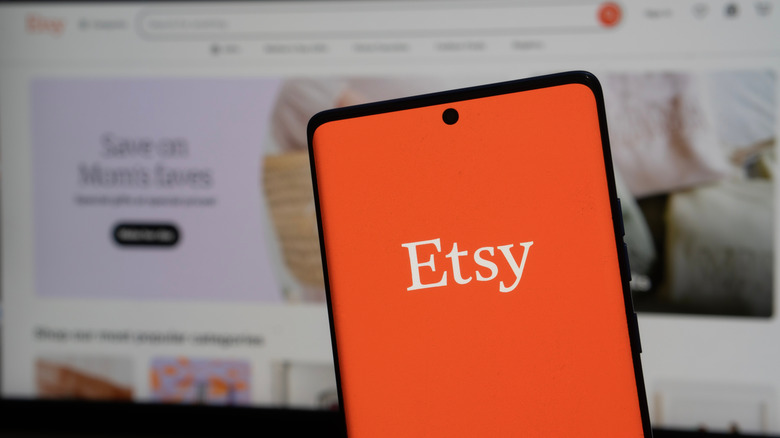 Phone displaying the Etsy brand
