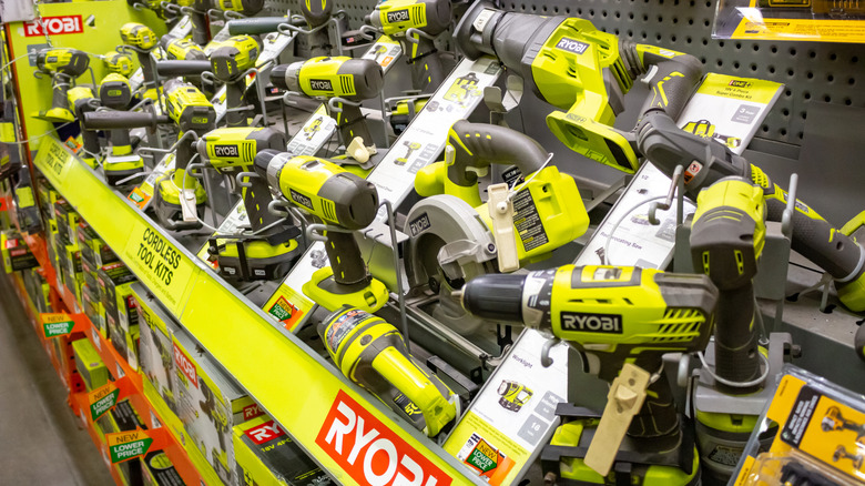 Store display of Ryobi brand drills and impact drivers
