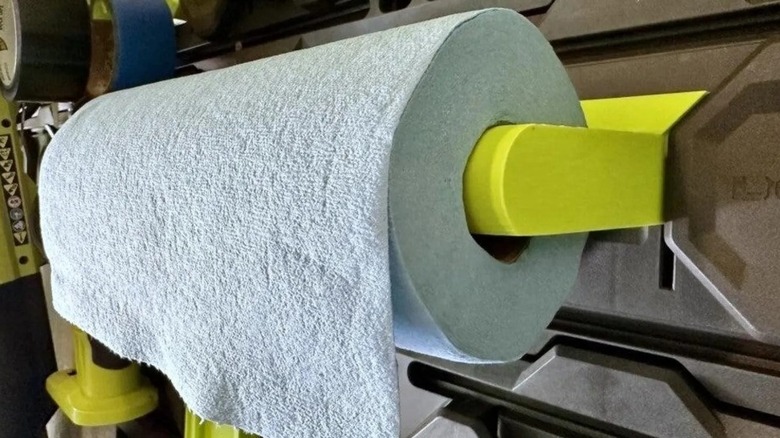 Roll of paper towels on a green holder