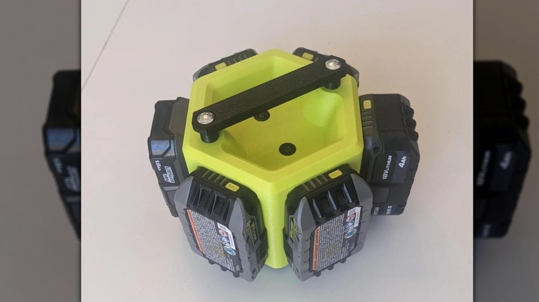 Battery holder featuring six batteries arranged in a hexagon