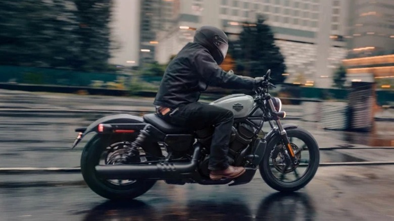 Riding a Harley-Davidson motorcycle on a wet road