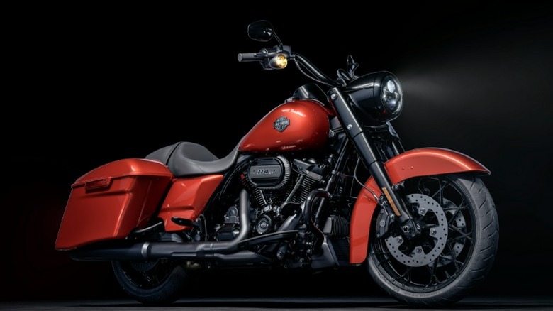 A 2025 Harley-Davidson Road King Special in a bold orange finish.
