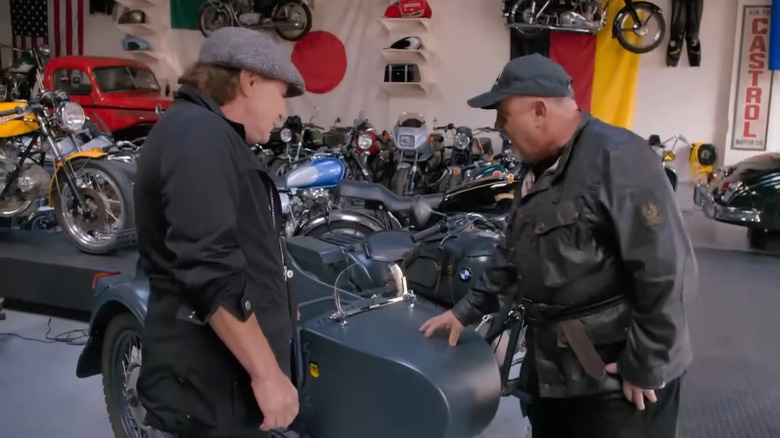 Billy Joel and Brian Johnson standing in front of the grey BMW R75