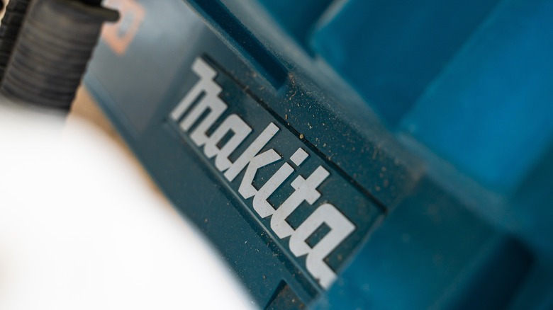 Closeup of the Makita logo on the side of a tool