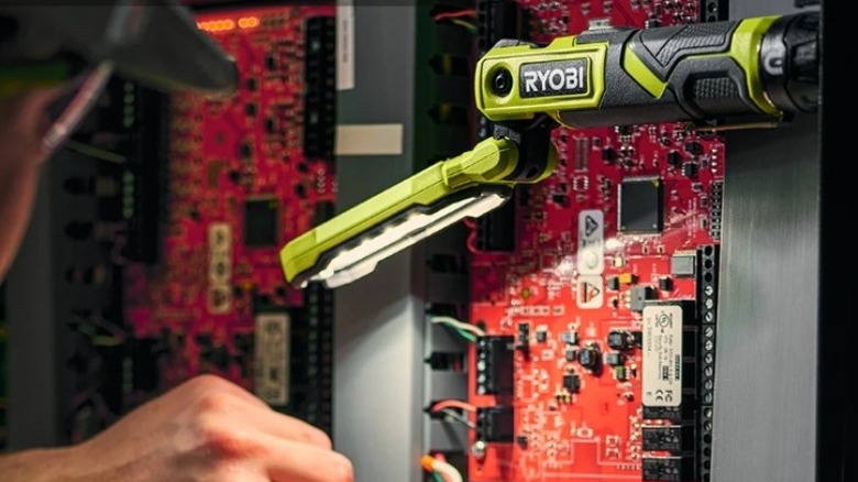 Elevated work light illuminating an electrical panel