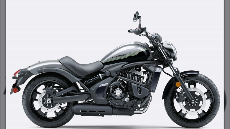 A Kawasaki Vulcan S cruiser motorcycle in a matte gray and black color scheme, displayed in a side profile against a plain light background.