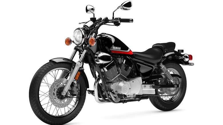 A Yamaha V Star 250 cruiser motorcycle in black with chrome accents, photographed from a front-side angle against a plain white background.