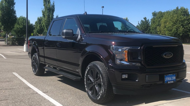 Magma Red Metallic F-150 parked in a lot