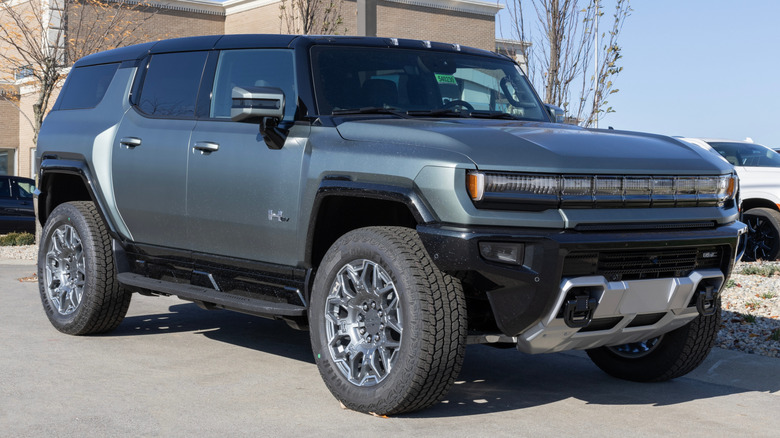 A GMC Hummer EV SUV parked near a building
