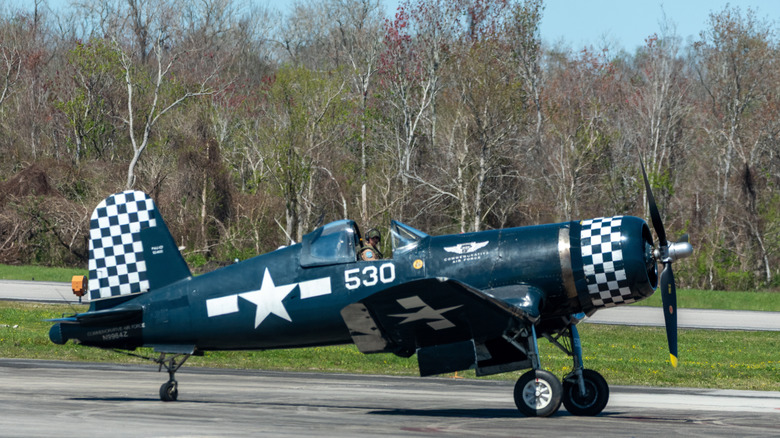 a Vought F4U Corsair on the tarmac