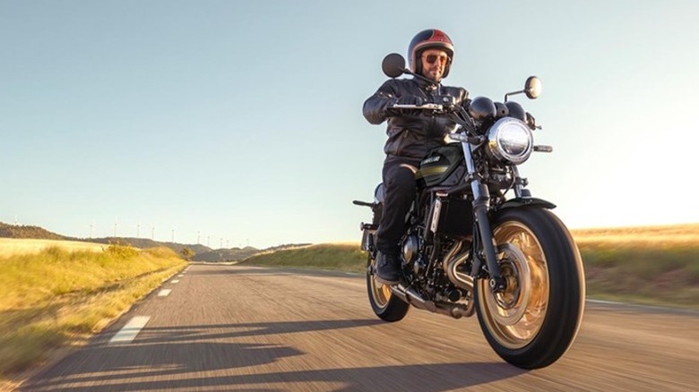 Man riding black Kawasaki Z650-RS
