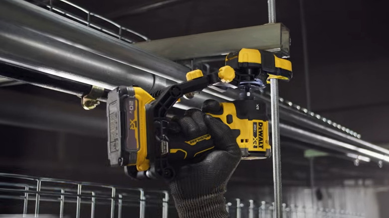 Person running nuts on a trapeze hanger